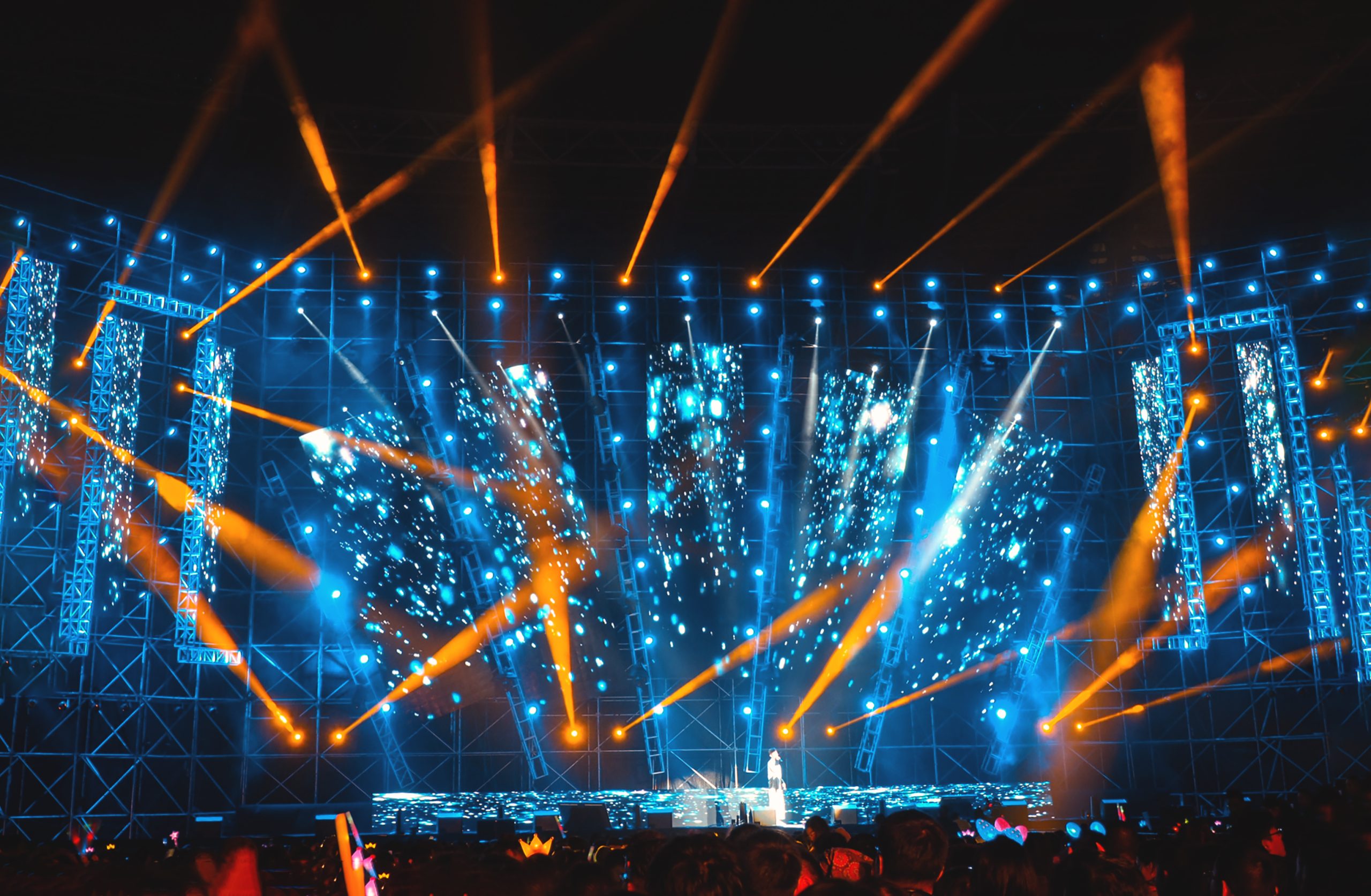 Modern architectural interior with clean linear LED lighting recessed into concrete walls and ceilings with dramatic shadows